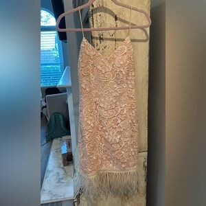 Brand new pink lace cocktail dress with feather detailing